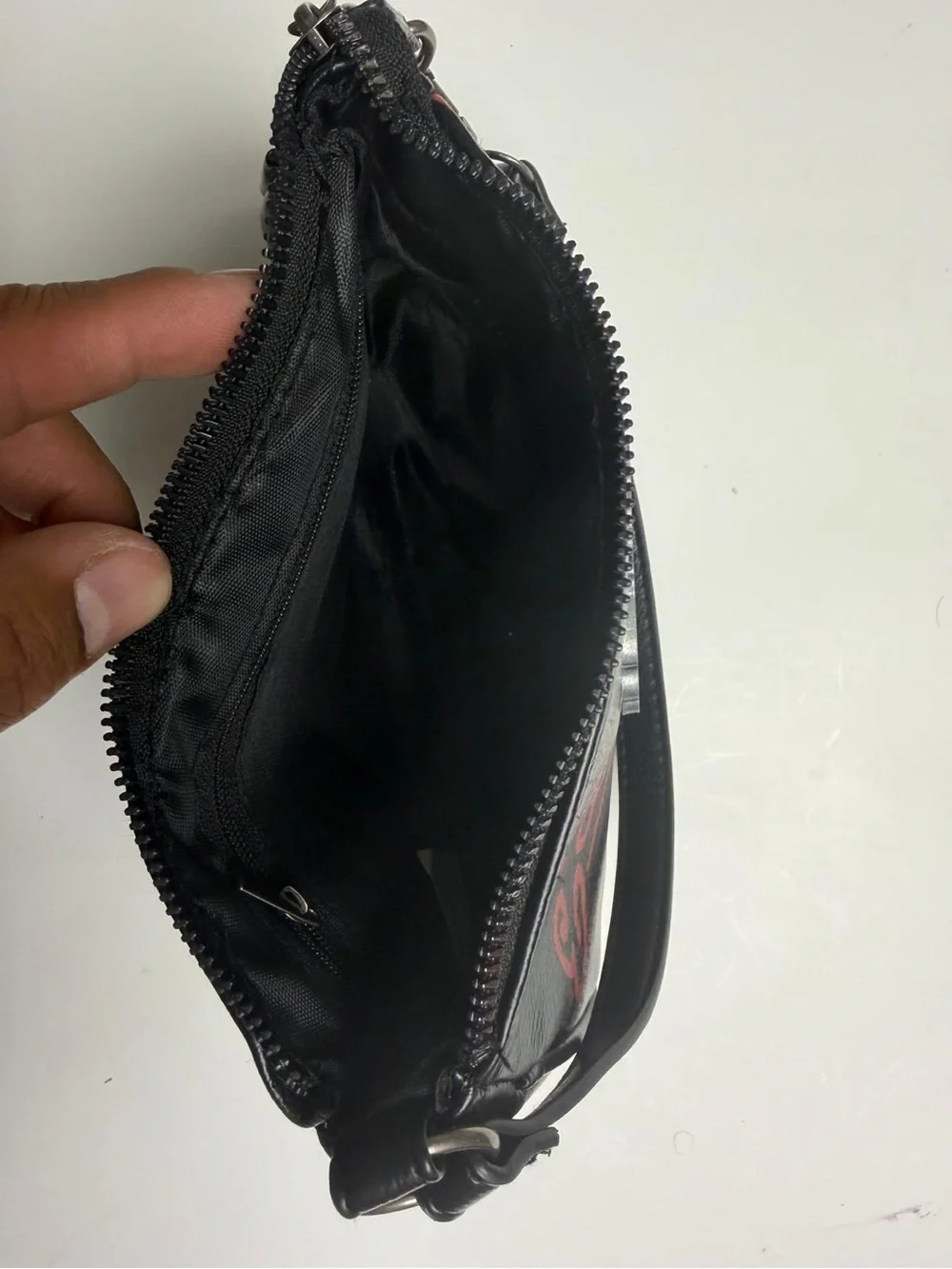 Es hardy Black Wristlet Bag with Embellished Heart Design